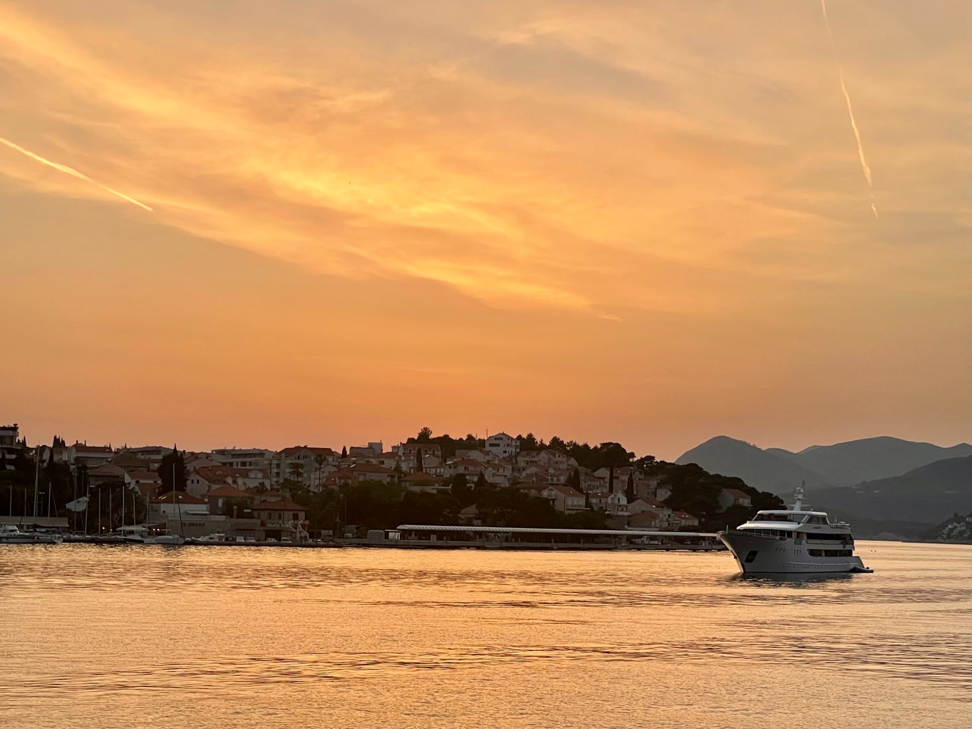 Yacht cruising at sunset on the Dalmatian Coast